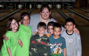 Elva with clients at a bowling event.